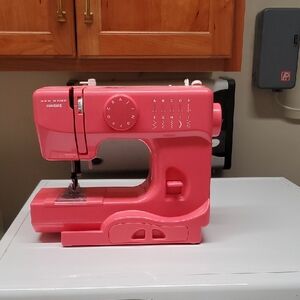 NEW, NO BOX NEW HOME JANOME SEWING MACHINE WITH PARTS, NEVER USED
